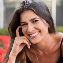 Smiling woman in black tank top