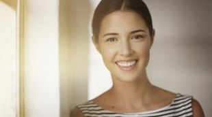 Smiling woman in striped blouse