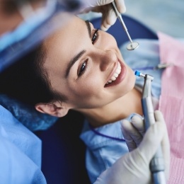 Woman smiling during a dental checkup