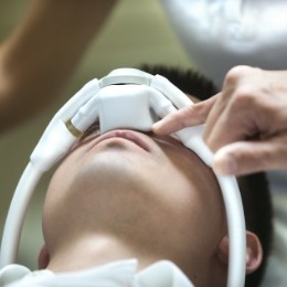 Man in dental chair with mask over his nose for nitrous oxide sedation dentistry